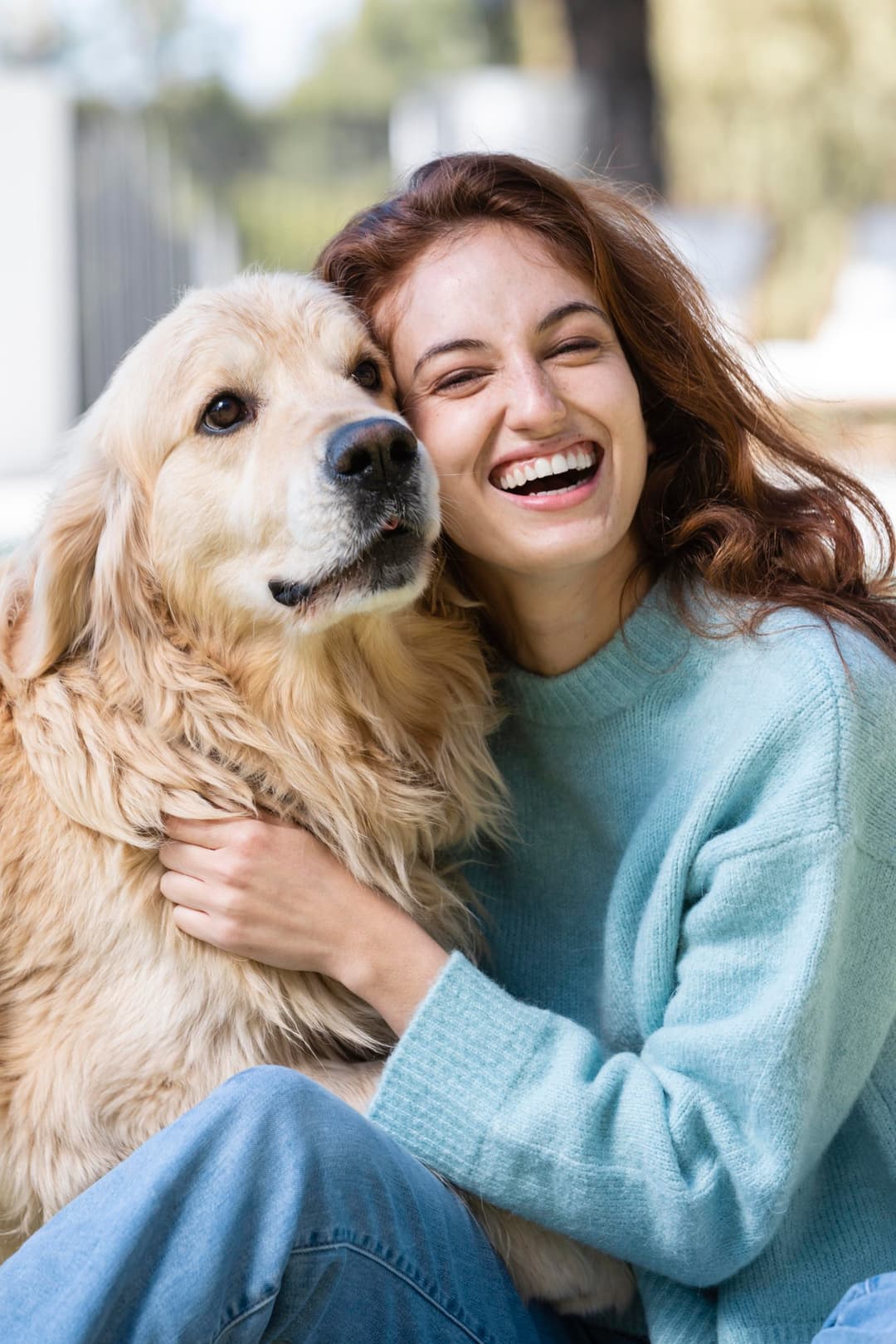 Woman smiling with a dog